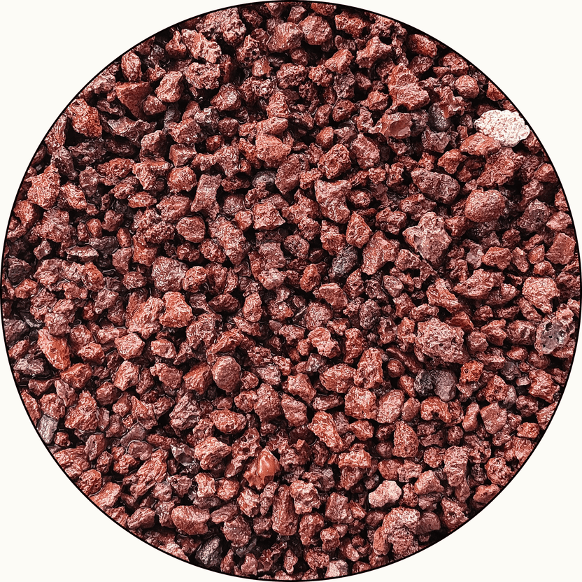 Close-up of reddish-brown aquarium substrate granules.
